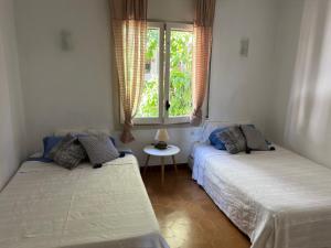 Posteľ alebo postele v izbe v ubytovaní Apartment ROC SANT GAÏTA - SEAFRONT View - PORT AVENTURA