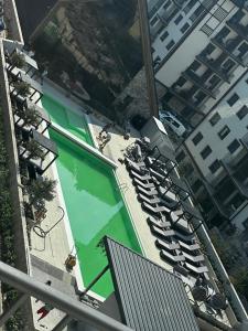 an overhead view of a swimming pool with chairs at Apartman Njegoš Lux Titova vila in Palisad