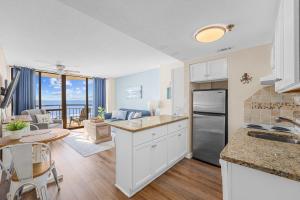 a kitchen and living room with a view of the ocean at Stunning 1 Bedroom Condo-Breathtaking Oceanfront Views-Meridian 602 in Myrtle Beach