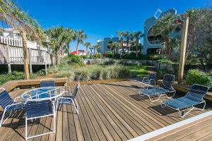 a deck with four chairs and a table on it at Hibiscus H204 in St. Augustine +90 photos
