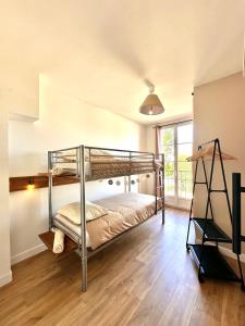Postel nebo postele na pokoji v ubytování Appartement chaleureux
