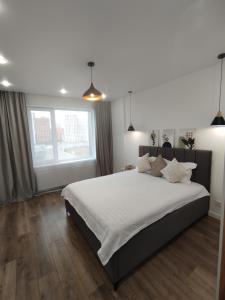 Katil atau katil-katil dalam bilik di Apartment near Astana Arena +9 gambar