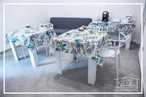 a table with two chairs with a table cloth on it at A casa di Claudia in Brindisi