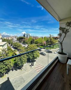 a balcony with a view of a city at Ideal Apartment Shkoder in Shkodër