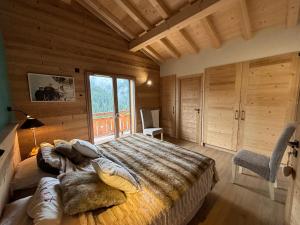 Katil atau katil-katil dalam bilik di Chalet luxe à proximité de Morzine