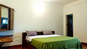 Postel nebo postele na pokoji v ubytování Heights Farm Stay - Coffee Estate Stay