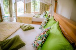 Postel nebo postele na pokoji v ubytování Evergreen Villa - Sinharaja