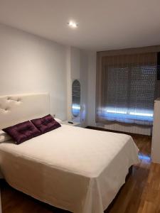 Postel nebo postele na pokoji v ubytování Apartamento coqueto en Rías Baixas-Cambados + 4 fotografie
