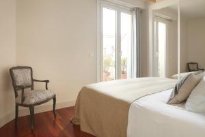 Ένα ή περισσότερα κρεβάτια σε δωμάτιο στο Garibay Terrace by FeelFree Rentals