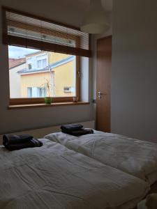 Posteľ alebo postele v izbe v ubytovaní Apartmán v centru města