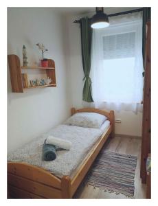 A bed or beds in a room at Holiday home in Balatonfenyves 27939