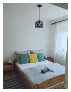 A bed or beds in a room at Holiday home in Balatonfenyves 27939