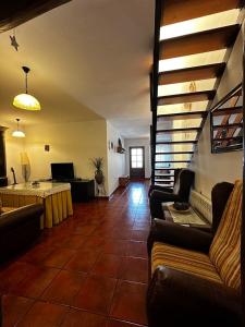 a living room with couches and a table at Espaciosa y Elegante Casa Rural en Los Marines in Los Marines +25 photos