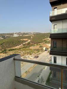 a view of a street from a balcony of a building at Luxury apartment Malabata hills in Tangier