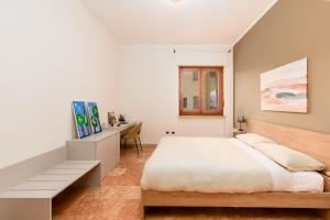 Letto o letti in una camera di Design Retreat a Saluzzo - Comfort e Stile Unico
