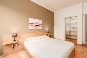 Letto o letti in una camera di Design Retreat a Saluzzo - Comfort e Stile Unico