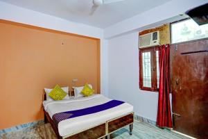 Letto o letti in una camera di SPOT ON Raj Hotel Vip Near Worlds Of Wonder