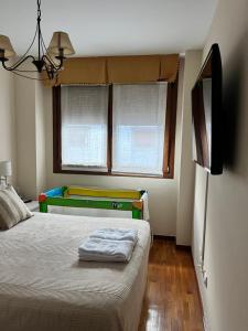 a bedroom with a bed and a pool table at La Nala in Villaviciosa +7 photos