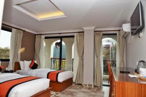 Sjónvarps- og/eða afþreyingartæki á Hotel Raniban Arcade