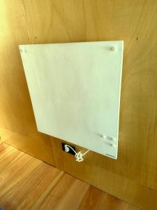 a metal box on a wooden wall with a sign at CABITO B & B in La Paloma