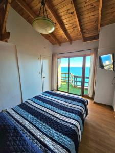 Postel nebo postele na pokoji v ubytování Al Mar Cabañas