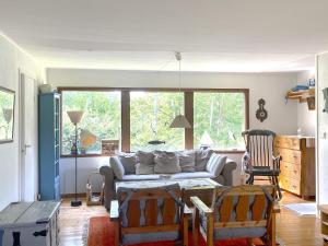 a living room with a couch and a table at 5 person holiday home in UDDEVALLA-By Traum in Lysekil