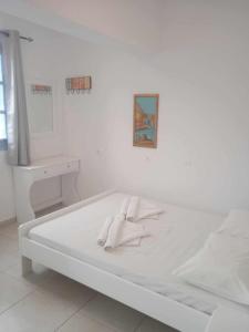 Postel nebo postele na pokoji v ubytování Kalymnos Platy Gialos Mousellis Makis Apartments
