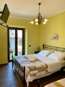 Postel nebo postele na pokoji v ubytování Agriturismo Torre Ercolana