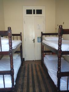 Cama ou camas em um quarto em Guanaaní Hostel