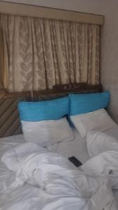 Ένα ή περισσότερα κρεβάτια σε δωμάτιο στο Paradise holiday Luxury Hotel Apartment