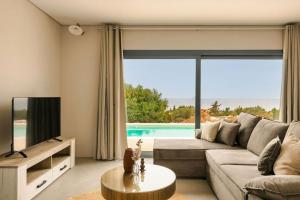 TV a/nebo společenská místnost v ubytování Villa Ivi - Zen Villas