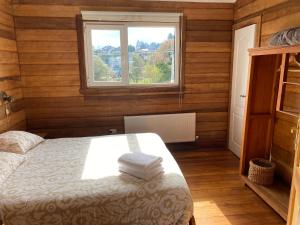 Postel nebo postele na pokoji v ubytování Hostal Compass del Sur