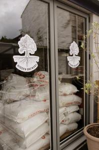 a display case filled with lots of white pillows at Seven Stars Penryn in Penryn +14 photos