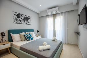 Postel nebo postele na pokoji v ubytování Mylos Modern Apartments,By Idealstay Experience