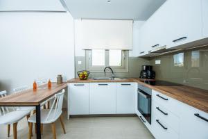 Kuchyň nebo kuchyňský kout v ubytování Mylos Modern Apartments,By Idealstay Experience