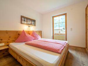 Łóżko lub łóżka w pokoju w obiekcie Blick zum Mayrhofen