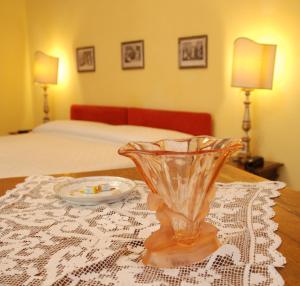 Postel nebo postele na pokoji v ubytování Locanda Borgonuovo
