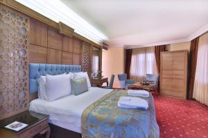 Postel nebo postele na pokoji v ubytování Budo Hotel