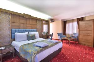 Postel nebo postele na pokoji v ubytování Budo Hotel + 37 fotografií