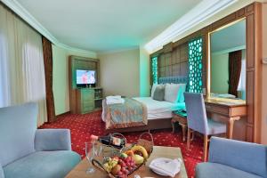 TV a/nebo společenská místnost v ubytování Budo Hotel