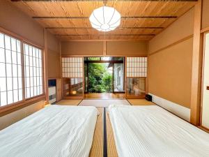 Postelja oz. postelje v sobi nastanitve 百代家 飛騨高山 初田町