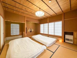 Postelja oz. postelje v sobi nastanitve 百代家 飛騨高山 初田町