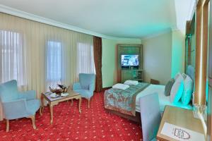 TV a/nebo společenská místnost v ubytování Budo Hotel