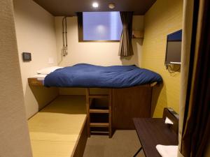 Voodi või voodid majutusasutuse Tabist Hotel Seishokan toas