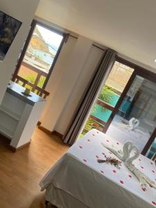 Ένα ή περισσότερα κρεβάτια σε δωμάτιο στο FLATS SHALON - MORRO DE SÃO PAULO