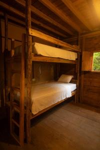 Ένα ή περισσότερα κρεβάτια σε δωμάτιο στο Casa Bambucha