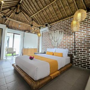 Postel nebo postele na pokoji v ubytování Kampoeng Villa Ubud