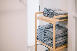 a stack of towels on a shelf in a closet at 惠 - Megumi Okinawa in Tokeshi +12 photos