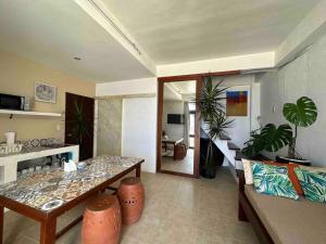 a living room with a table and a couch at Two Bedroom Affordable Beach Front House in Boracay