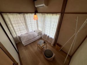 Postel nebo postele na pokoji v ubytování 湊庵 路考茶-so-an rokocha-
